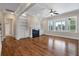 Cozy living room with fireplace, built-in shelves, ceiling fan, and lots of natural light at 3028 River Vista Drive Way, Mount Pleasant, SC 29466