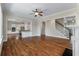 Open floor plan featuring hardwood floors, ceiling fan, and views into the kitchen at 3028 River Vista Drive Way, Mount Pleasant, SC 29466