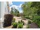 Brick patio with fire pit and beautifully manicured landscaping at 3028 River Vista Drive Way, Mount Pleasant, SC 29466