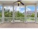 Covered porch with white columns and railings overlooking a landscaped neighborhood at 3028 River Vista Drive Way, Mount Pleasant, SC 29466