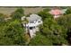 Aerial view of a beautiful low country house with large trees at 31 Seagrass Ln, Isle of Palms, SC 29451