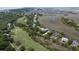 Aerial view of a golf course surrounded by a low country neighborhood and tidal marshes at 31 Seagrass Ln, Isle of Palms, SC 29451