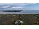 Stunning aerial view of coastal homes with private boardwalk leading to a beautiful sandy beach and ocean at 31 Seagrass Ln, Isle of Palms, SC 29451