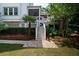 Staircase leading up to a screened-in back porch with mature landscaping at 31 Seagrass Ln, Isle of Palms, SC 29451