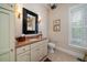 Cozy bathroom with stylish vanity, mirror, and natural light at 31 Seagrass Ln, Isle of Palms, SC 29451