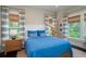 Bright bedroom with a comfortable blue bed and plenty of natural light at 31 Seagrass Ln, Isle of Palms, SC 29451