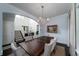 Elegant dining room with a chandelier, large table, and blue walls at 31 Seagrass Ln, Isle of Palms, SC 29451
