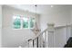 Bright hallway featuring white shiplap walls and a decorative chandelier at 31 Seagrass Ln, Isle of Palms, SC 29451