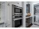 Integrated stainless oven and microwave with butler's pantry in background at 31 Seagrass Ln, Isle of Palms, SC 29451