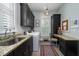 Functional laundry room featuring a utility sink, washer, dryer, and a built-in desk area at 31 Seagrass Ln, Isle of Palms, SC 29451