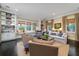 Bright living room features built-ins, large windows, and comfortable seating arrangements at 31 Seagrass Ln, Isle of Palms, SC 29451