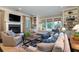 Living room showcases a fireplace, custom built-ins, and access to the outdoors at 31 Seagrass Ln, Isle of Palms, SC 29451