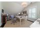 Bright home office with a large desk, custom bookshelves and natural light at 31 Seagrass Ln, Isle of Palms, SC 29451