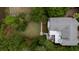 Aerial view showcases a home with a backyard featuring a patio and lush landscaping at 31 Seagrass Ln, Isle of Palms, SC 29451