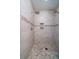 Modern tiled shower with multiple shower heads and built-in shelving at 31 Seagrass Ln, Isle of Palms, SC 29451