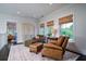 Comfortable sitting area with armchairs, ottoman, and natural light at 31 Seagrass Ln, Isle of Palms, SC 29451