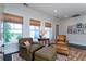 Bright sitting area with cozy armchairs and a view of the outside at 31 Seagrass Ln, Isle of Palms, SC 29451