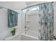 Bathroom featuring shower and tub combination, modern shower curtain, and a window for natural light at 312 Cypress Knee Landing, Summerville, SC 29483