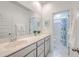 Bright bathroom featuring a large mirror, ample vanity storage, and a separate water closet for added privacy at 312 Cypress Knee Landing, Summerville, SC 29483