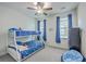 A cozy bedroom features a bunk bed and a ceiling fan for a comfortable and stylish space at 312 Cypress Knee Landing, Summerville, SC 29483