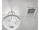 A modern chandelier illuminates the ceiling, adding a touch of sophistication to the space at 312 Cypress Knee Landing, Summerville, SC 29483