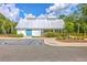 Community building with designated handicap parking spots, blue door, and picnic area in the back at 312 Cypress Knee Landing, Summerville, SC 29483