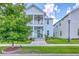 Charming two-story home with a welcoming porch, manicured lawn, and vibrant landscaping for curb appeal at 312 Cypress Knee Landing, Summerville, SC 29483