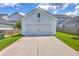 Detached garage with a white door and concrete driveway at 312 Cypress Knee Landing, Summerville, SC 29483