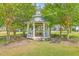 Charming gazebo surrounded by lush trees, offering a peaceful retreat at 312 Cypress Knee Landing, Summerville, SC 29483