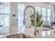 Modern kitchen featuring stainless steel sink with high-arc faucet and an island counter for dining at 312 Cypress Knee Landing, Summerville, SC 29483