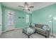 An inviting living room has mint green walls and a plush grey sofa perfect for relaxation and comfort at 312 Cypress Knee Landing, Summerville, SC 29483