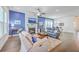 Spacious open concept living room featuring hardwood floors, fireplace, furniture, and eat-in kitchen at 312 Cypress Knee Landing, Summerville, SC 29483
