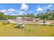 Community playground with a boat structure and picnic tables with a grassy area at 312 Cypress Knee Landing, Summerville, SC 29483