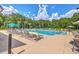 A sparkling community pool surrounded by lounge chairs and lush landscaping at 312 Cypress Knee Landing, Summerville, SC 29483
