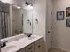 Bathroom with double sink vanity, updated hardware, and a large mirror at 317 Whispering Breeze Ln, Summerville, SC 29486