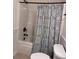 Bathroom showcasing a tub and a blue patterned shower curtain at 317 Whispering Breeze Ln, Summerville, SC 29486