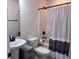 This bright bathroom features a toilet, sink, shower and vanity at 317 Whispering Breeze Ln, Summerville, SC 29486