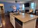 Kitchen island featuring a stainless steel dishwasher and granite countertops at 317 Whispering Breeze Ln, Summerville, SC 29486