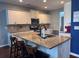 Spacious kitchen featuring island with barstool seating and modern appliances at 317 Whispering Breeze Ln, Summerville, SC 29486