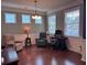 The living room has two lounge chairs, a gaming desk, and windows that let in natural light at 317 Whispering Breeze Ln, Summerville, SC 29486