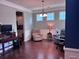 The living room has chair seating, a gaming desk, and windows that let in natural light at 317 Whispering Breeze Ln, Summerville, SC 29486