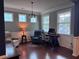 This living room features chair seating, a gaming desk, and windows with natural light at 317 Whispering Breeze Ln, Summerville, SC 29486