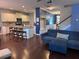 Open-concept living room with a fireplace, dining area, and modern kitchen, great for entertaining at 317 Whispering Breeze Ln, Summerville, SC 29486