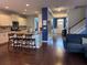 A spacious living room features an island with barstool seating and hardwood floors at 317 Whispering Breeze Ln, Summerville, SC 29486