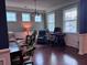 Cozy living space featuring hardwood floors, plenty of natural light, and comfortable seating at 317 Whispering Breeze Ln, Summerville, SC 29486