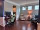 Cozy living space featuring hardwood floors, plenty of natural light, and comfortable seating at 317 Whispering Breeze Ln, Summerville, SC 29486