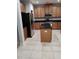Kitchen with wood cabinets, stainless steel appliances, an island, and tile flooring at 322 Braken Fern Rd, Moncks Corner, SC 29461