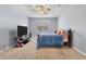 Bedroom featuring soft carpet, a ceiling fan, and a wooden-framed bed bathed in natural light at 324 Spruce Ivy St, Moncks Corner, SC 29461