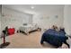 Bright bedroom with two twin beds, plush carpet, and playful decor on the wall at 324 Spruce Ivy St, Moncks Corner, SC 29461