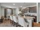 Open kitchen boasts stainless steel appliances, granite countertops, and a central island with barstool seating at 324 Spruce Ivy St, Moncks Corner, SC 29461